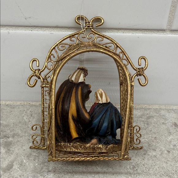 Gold Nativity Scene Christmas Ornament. 4.5x2x4 in. Metal and resin. - Picture 3 of 6